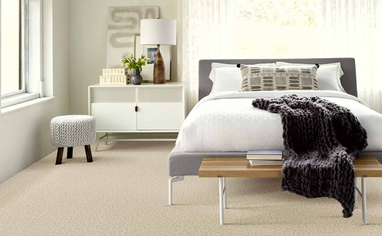 plush cut pile carpet in cozy bedroom with throw